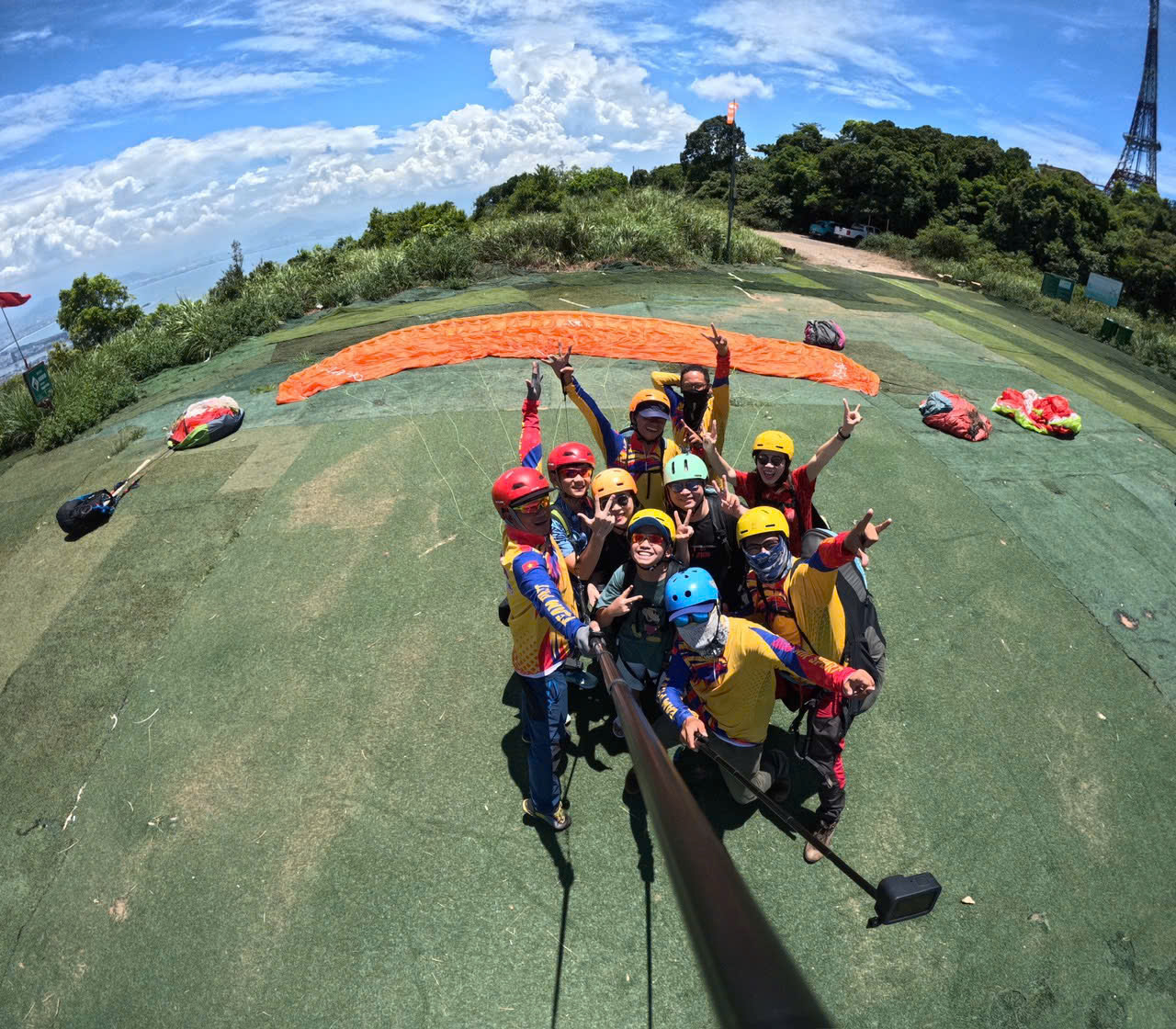 Tandem paragliding in Da Nang with a view of the ocean and city skyline